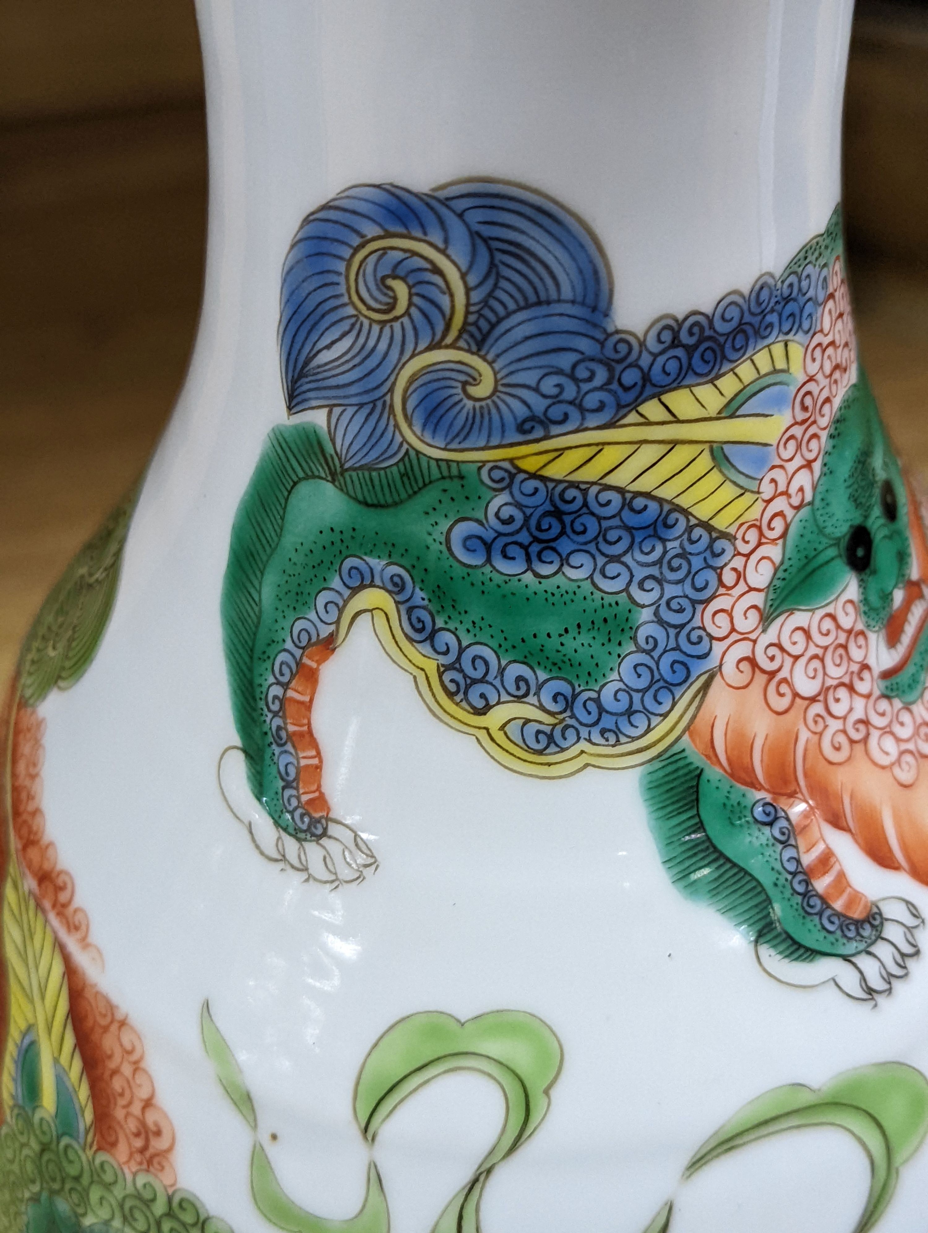 A Chinese famille verte pear-shaped ‘Buddhist lion’ vase, on stand, 32 cms high not including stand